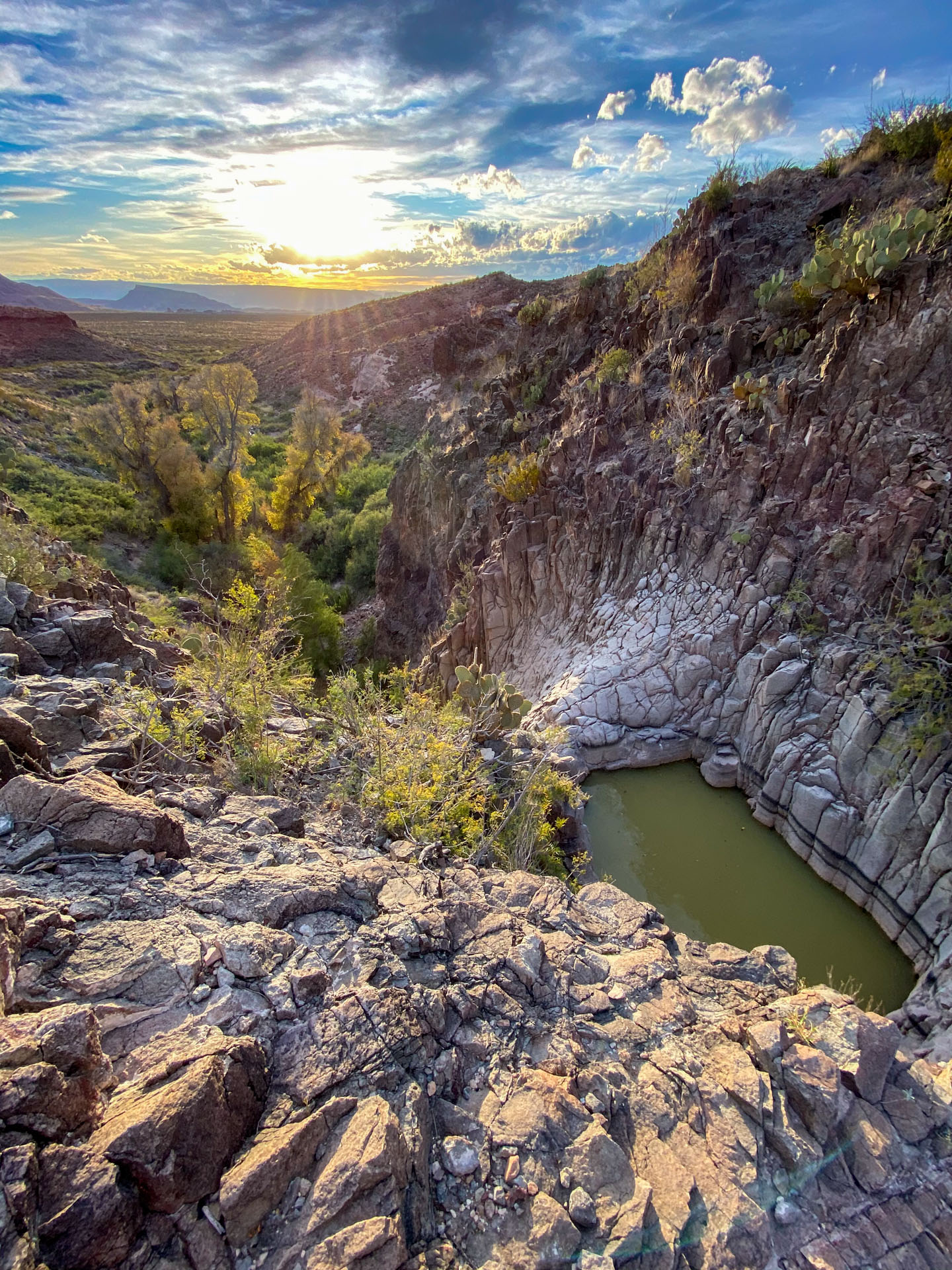 Looking down at a desert vista and burro spring in big bend national park during the golden hour